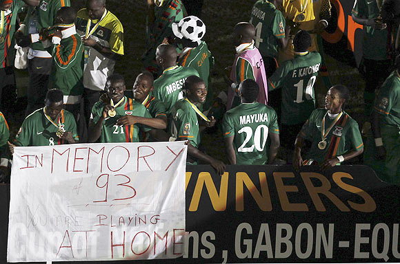 Zambia players hold the banner up for victims of the Zambian Air Force Buffalo plane crash. The plane that was carrying Zambia's national football team crashed into the Atlantic Ocean about 500 metres offshore from Libreville on April 27, 1993, killing all 25 passengers and five crew members