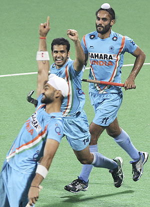 Indian hockey players celebrate after win