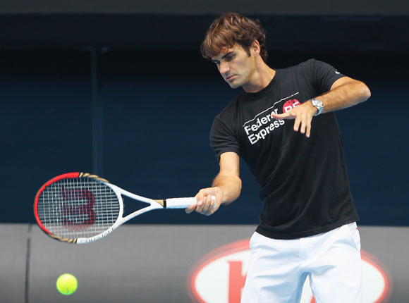 Roger Federer of Switzerland plays a forehand during a practice session ahead of the 2012 Australian Open at Rod Laver Arena