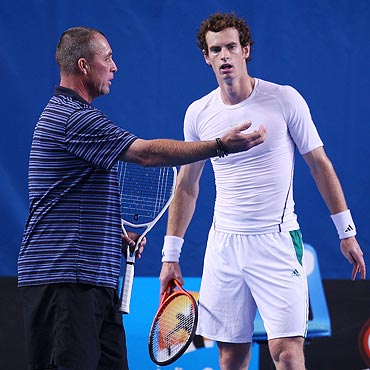Andy Murray listens to his coach Ivan Lendl during a practice session