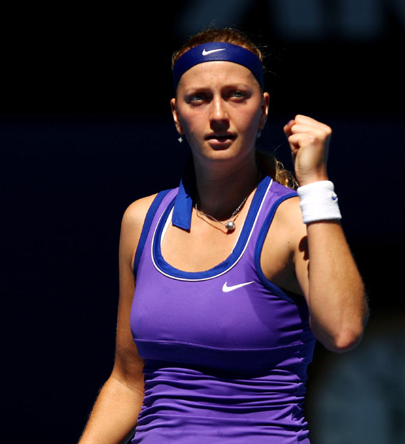Petra Kvitova of the Czech Republic celebrates a point in her fourth round match against Ana Ivanovic of Serbia