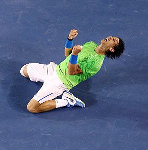 Rafael Nadal celebrates winning his semi-final match against Roger Federer