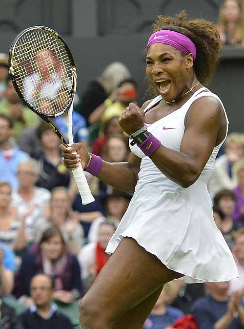 Serena Williams of the U.S. celebrates after defeating Petra Kvitova of the Czech Republic in their women's quarter-final tennis match at the Wimbledon