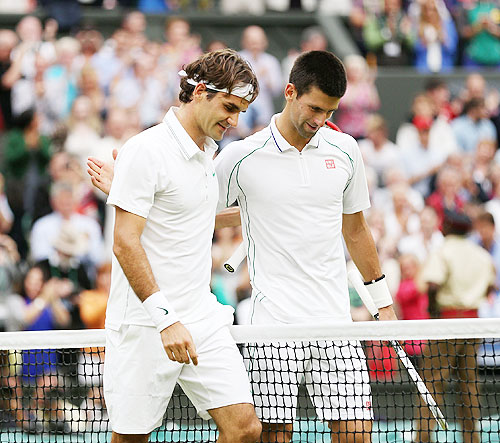 Roger Federer (left) is congratulated by Novak Djokovic