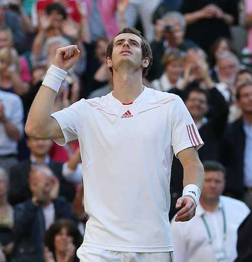 Andy Murray celebrates after his singles semi-final match against Jo-Wilfried Tsonga on day eleven of the Wimbledon