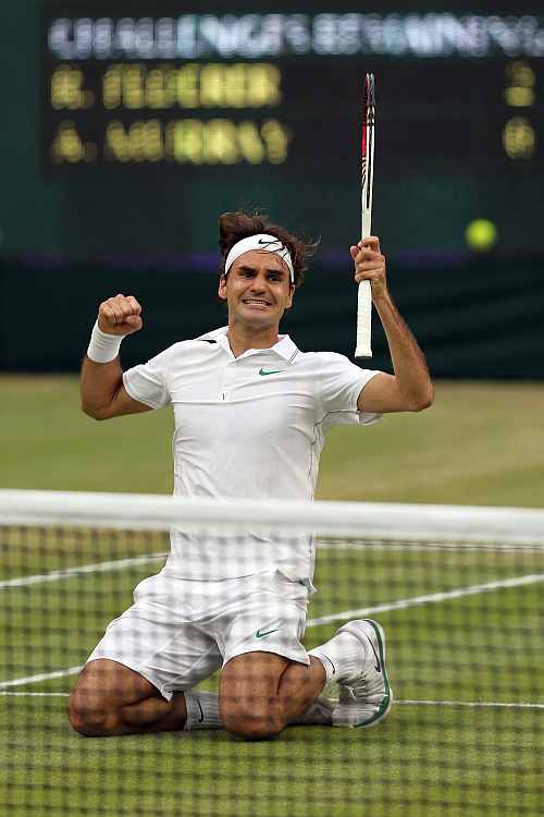 Roger Federer celebrates match point during his Men's singles final match against Andy Murray at the Wimbledon