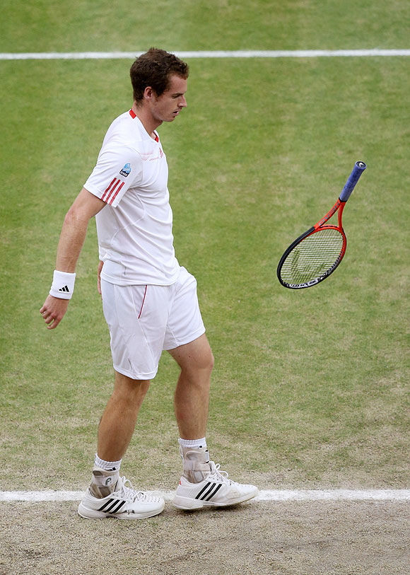 Andy Murray drops his racquet his frustration during his final against Roger Federer on Sunday