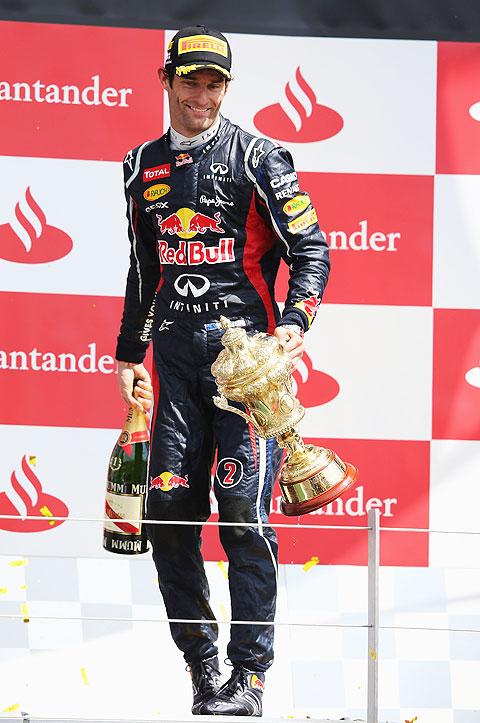 Red Bull Racing's Mark Webber celebrates on the podium after winning the British Grand Prix at Silverstone on Sunday