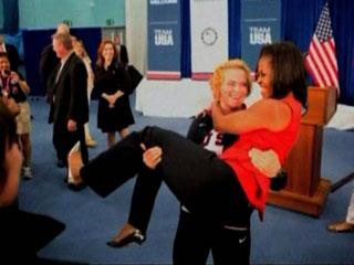 Michelle Obama is carried by US lifter Elena Pirozhkova