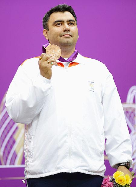 Bronze medallist Gagan Narang of India poses with the bronze medal