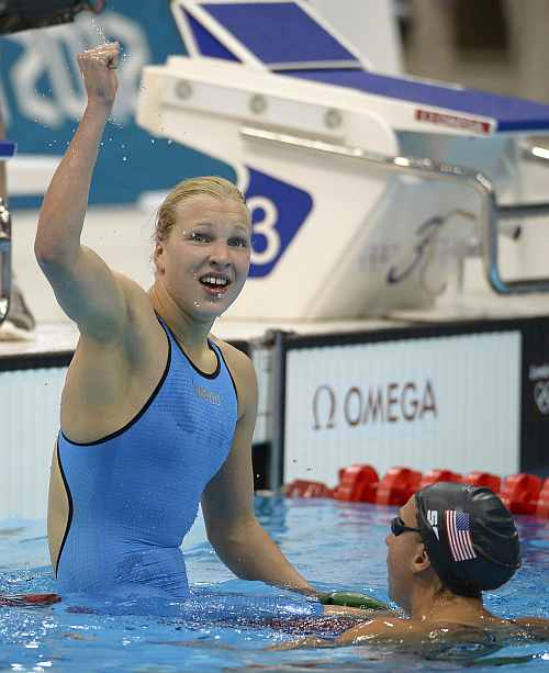 Lithuania's Ruta Meilutyte reacts after winning in the women's 100-meter breaststroke swimming final