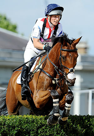 Zara Phillips of Great Britain riding High Kingdom negotiates a jump in the Eventing Cross Country Equestrian event on Monday