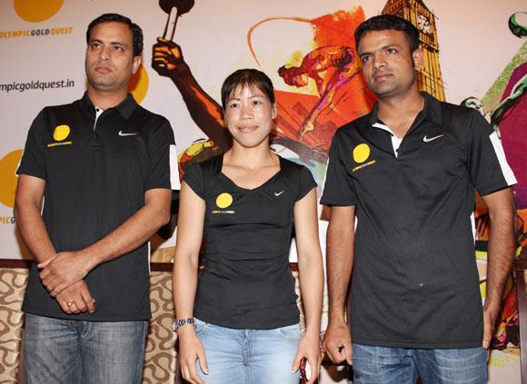 Sanjeev Rajout, Mary Kom and Vijay Kumar at an OGQ function in Mumbai on Thursday