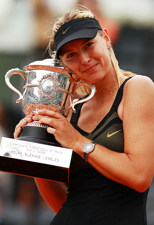 Russia's Maria Sharapova with the Coupe Suzanne Lenglen trophy after winning the women's singles final against Italy's Sara Errani
