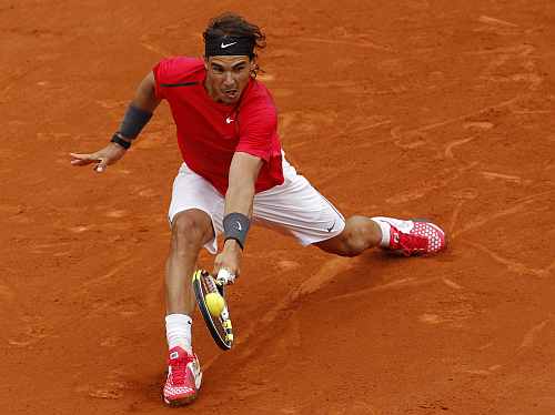 Rafael Nadal of Spain returns the ball to Novak Djokovic of Serbia during their men's singles final match at the French Open