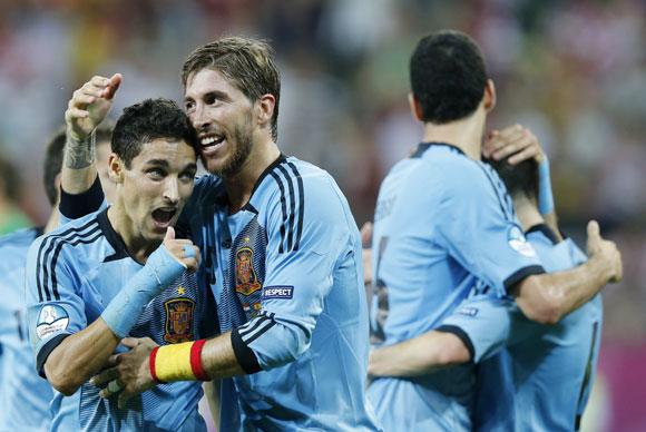 Spain's Jesus Navas (L) celebrates with his team mate Sergio Ramos after scoring a goal against Croatia during their Group C match at the PGE Arena in Gdansk