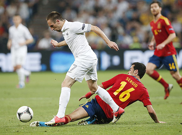 France's Franck Ribery (left) is challenged by Spain's Sergio Busquets