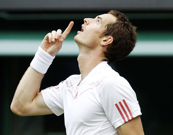 Andy Murray reacts after defeating Nikolay Davydenko