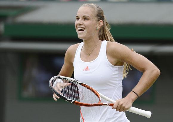 Arantxa Rus of the Netherlands reacts after defeating Samantha Stosur of Australia in their women's singles tennis match at the Wimbledon tennis championships in London