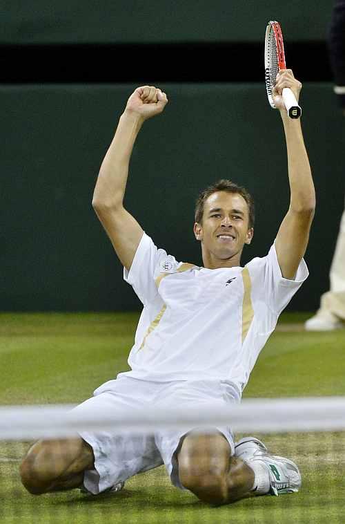 Lukas Rosol celebrates after defeating Rafael Nadal in their men's singles match at the Wimbledon in London