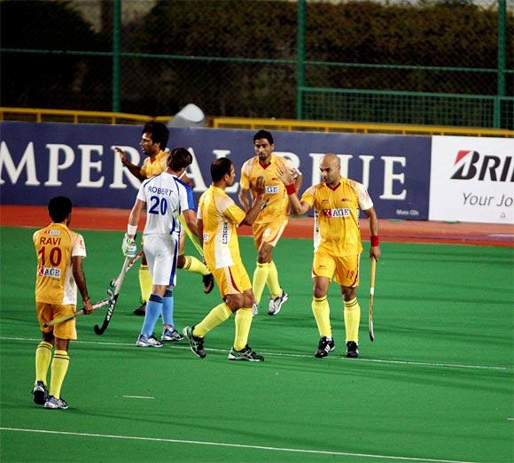 Len Aiyappa (right) celebrates with team-mates after scoring a goal