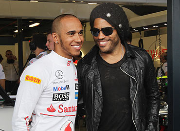 Rock musician Lenny Kravitz meets Lewis Hamilton in the McLaren Mercedes Paddock on Friday