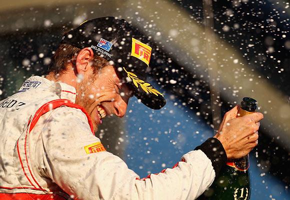 McLaren's Jenson Button celebrates on the podium after winning the Australian Formula One Grand Prix on Sunday