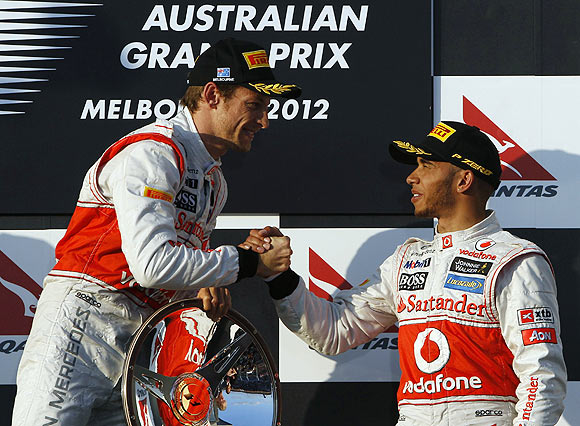 McLaren's Jenson Button is congratulated by teammate Lewis Hamilton on the podium after the Australian GP on Sunday