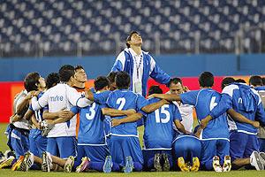 El Salvador pray after beating US to qualify for the Olympics after their CONCACAF Olympic qualifying match in Nashville, Tennessee on Monday