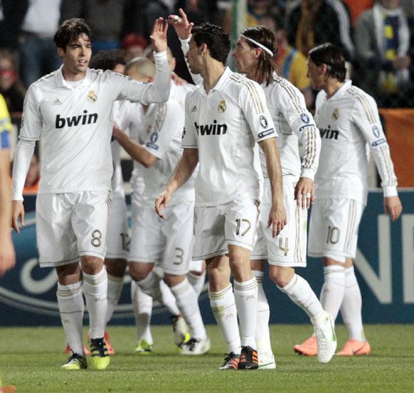 Madrid's Kaka (C) is congratulated by team mate after scoring a goal against APOEL during their Champions League quarter-final first leg soccer match at GSP stadium in Nicosia