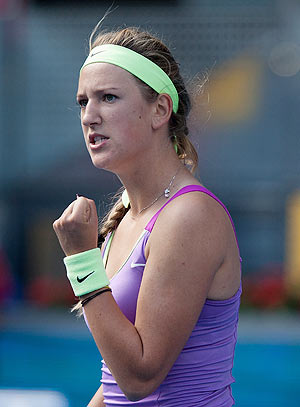 Victoria Azarenka of Belarus reacts after winning a game against Svetlana Kuznetsova of Russia during the second day of the WTA Mutua Madrilena Madrid Open Tennis on Sunday