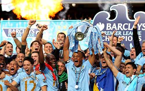 Manchester City players celebrate after winning the English Premier League title in London