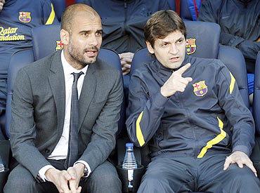 Barcelona's coach Pep Guardiola (left) and his assistant coach Tito Vilanova