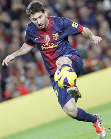 Barcelona's Lionel Messi keeps control of the ball