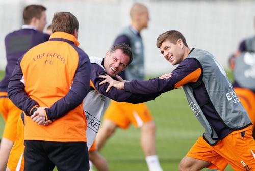 Liverpool manager Brendan Rodgers with Jamie Carragher and team captain Steven Gerrard