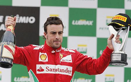 Ferrari's Fernando Alonso from Spain, right, drives his car in between the  pack during the European Formula One Grand Prix at Valencia street circuit,  Spain, Sunday, June 24, 2012. The race takes