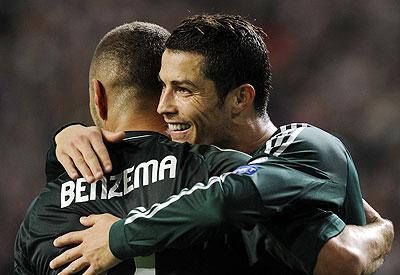 Real Madrid's Cristiano Ronaldo (right) and Karim Benzema celebrate a goal during their Champions League match against Ajax Amsterdam on Wednesday