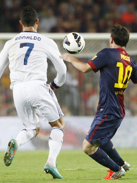 Barcelona's Lionel Messi (right) and Real Madrid's Cristiano Ronaldo