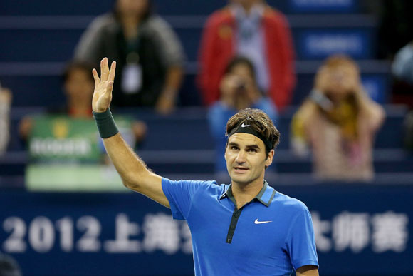 Roger Federer of Switzerland acknowledges the crowd after his win over Marin Cilic of Croatia