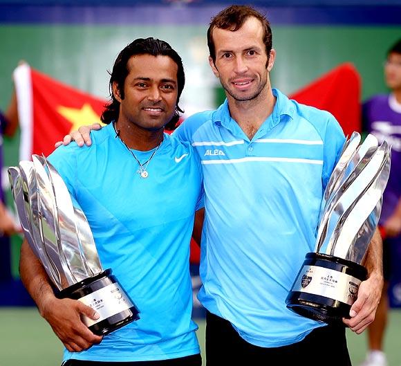 Leander Paes and Radek Stepanek pose after winning the Shanghai Masters title