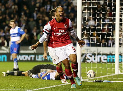 Theo Walcott of Arsenal celebrates after scoring against Reading on Tuesday