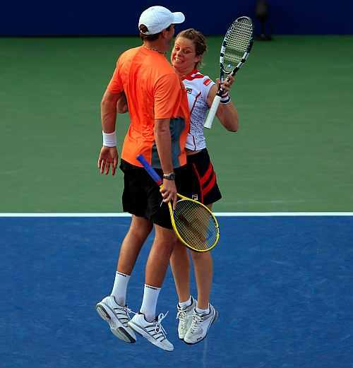 Kim Clijsters of Belgium and her partner Bob Bryan of the United States reacts after defeating Irina Falconi of the United States and Steve Johnson of the United States