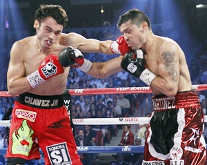 WBC middleweight champion Julio Cesar Chavez Jr. (left) of Mexico fights against Sergio Martinez of Argentina