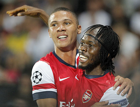 Arsenal's Gervinho (right) celebrates with teammate Kieran Gibbs after scoring the second goal against Montpellier