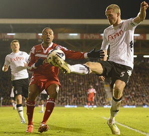 Fulham's Brede Hangeland (right) tackles Queens Park Rangers Loic Remy