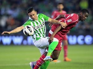 Real Betis' Ruben Castro (left) and Sevilla's Geoffrey Kondogbia