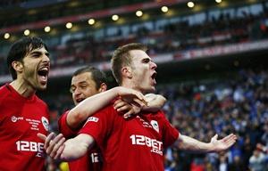 Wigan Athletic's Callum McManaman (centre) celebrates