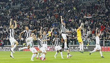 Jubilant Juventus players after their win over AC Milan on Sunday