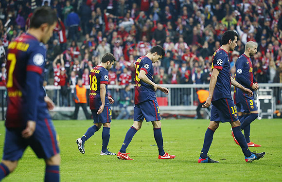 Barcelona's players react after losing 4-0 against Bayern Munich on Tuesday