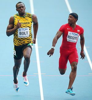 Usain Bolt of Jamaica and Mike Rodgers of the United States compete in the Men's 100 metres semi-final on Day Two of the 14th IAAF World Athletics Championships at Luzhniki Stadium in Moscow, on Sunday